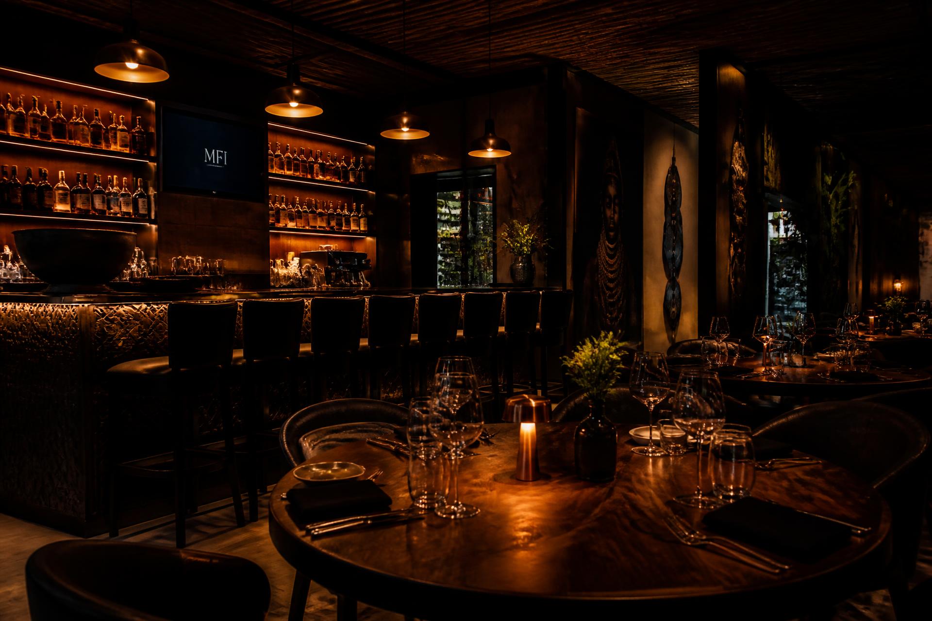 The dimly lit bar and dining room at Shadows Restaurant & Pub